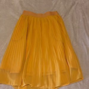 Mustard yellow pleated midi skirt